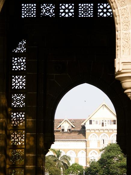 Looking through the Gateway to India in Mumbai Late afternoon sunlight looking through the carved stone mughal designed gate in Bombay India