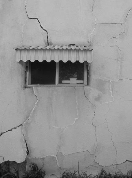 Window and cracked stucco in Nicodemus Kansas Black and white photograph by Rana Banerjee of a, Nicodemus, Kansas