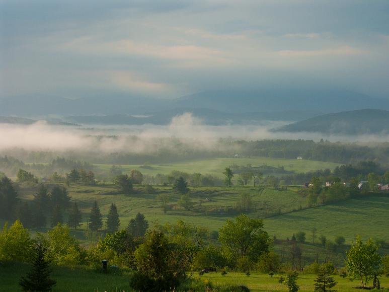 Early morning mist clears over the Green Mountains in Fairfax Vermont From my parents home