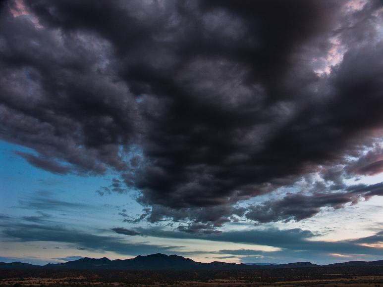 Dark clouds over the Ortiz mountains near Cerillos New Mexico