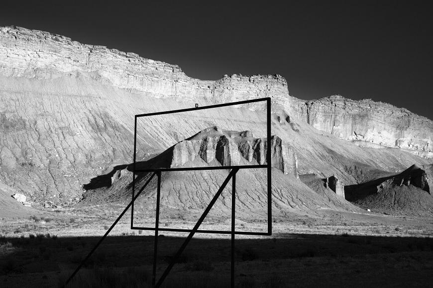Frame of old roadside sign and sandstone cliffs in southern Utah