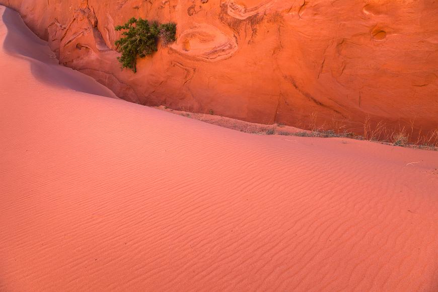 Pink shimmering sands and orange sandstone walls